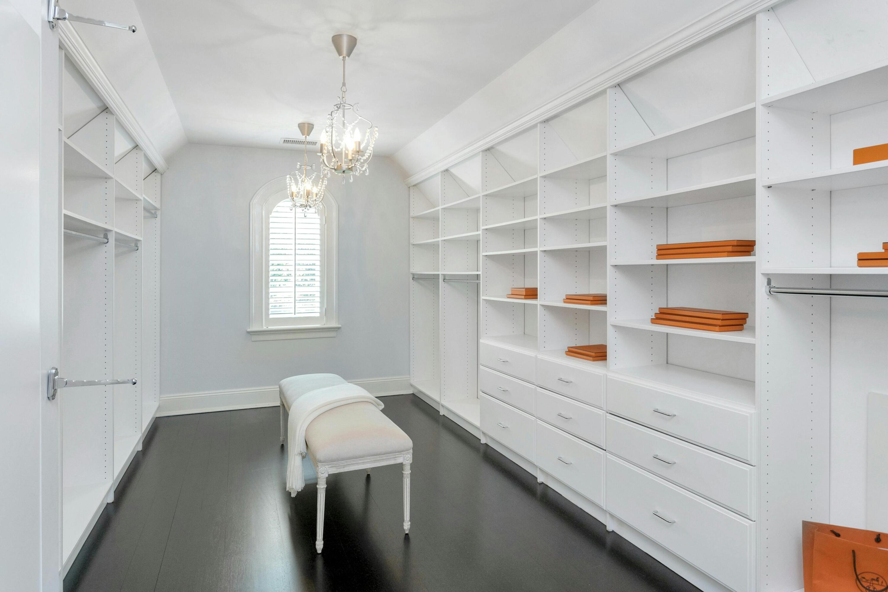378 Brookside Road Darien, CT 06820 - Photo 25 of 40 a view of a hallway with closet and chandelier