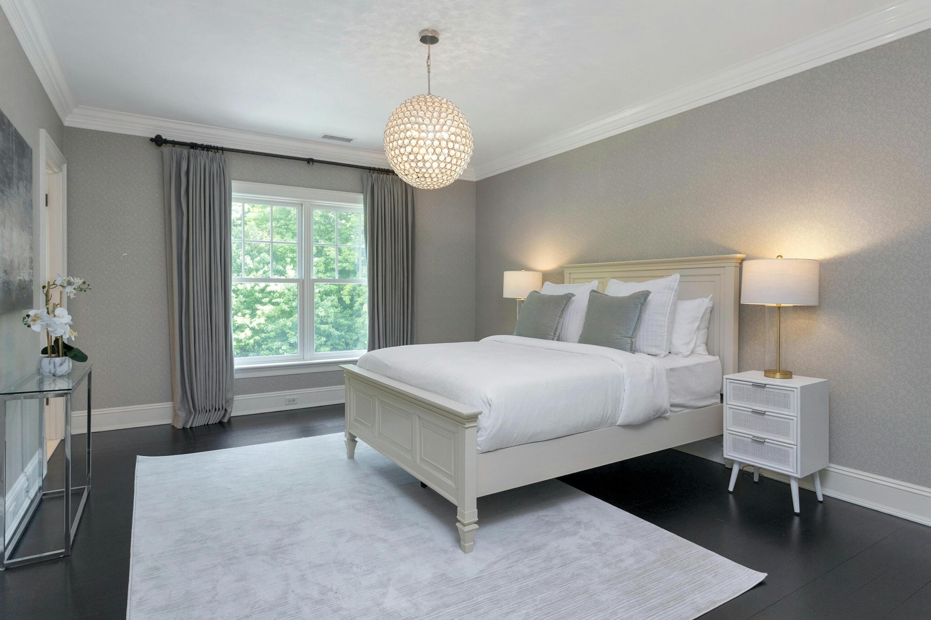 378 Brookside Road Darien, CT 06820 - Photo 28 of 40 a spacious bedroom with a bed and a table in it