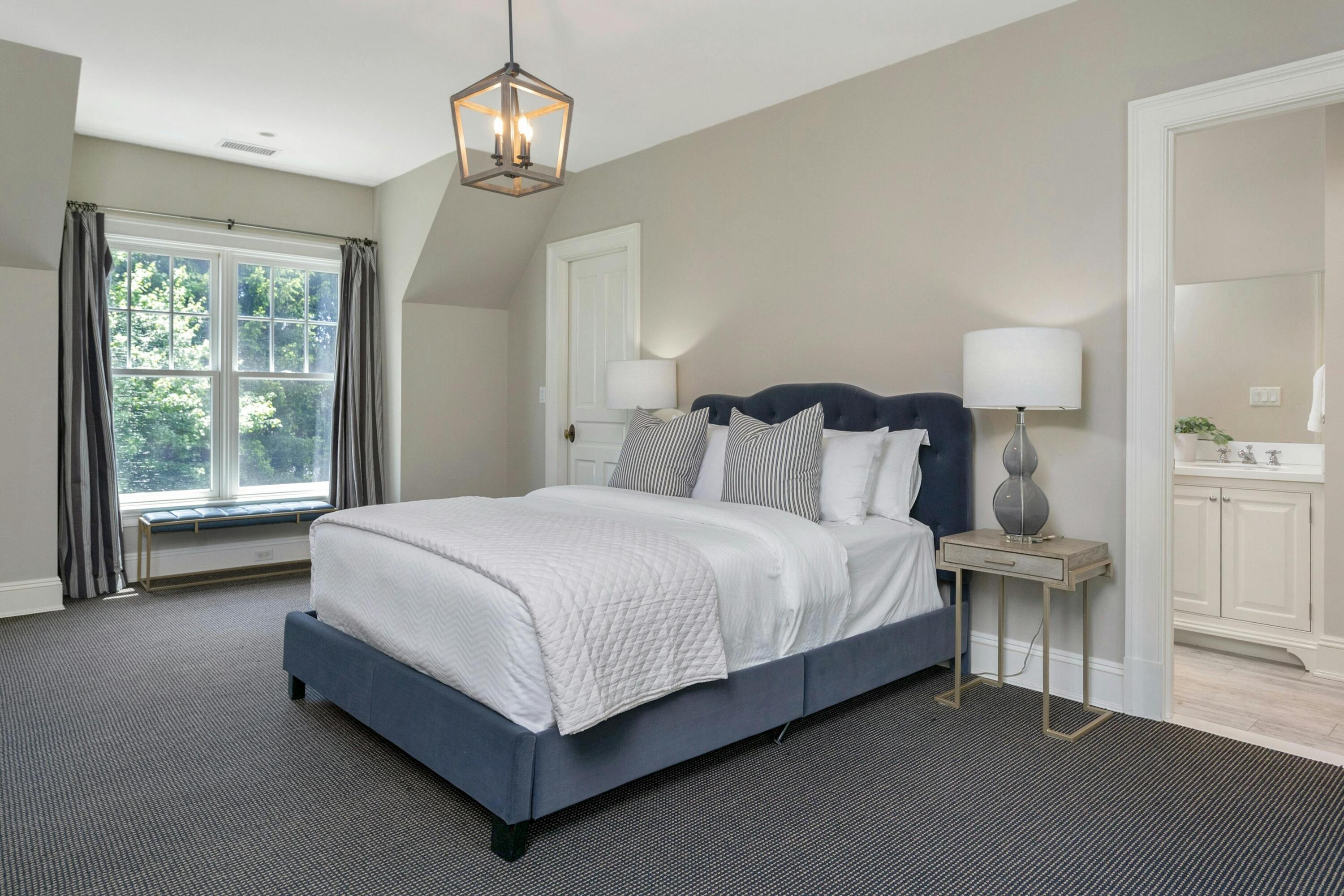 378 Brookside Road Darien, CT 06820 - Photo 31 of 40 a large bed sitting in a bedroom next to a window