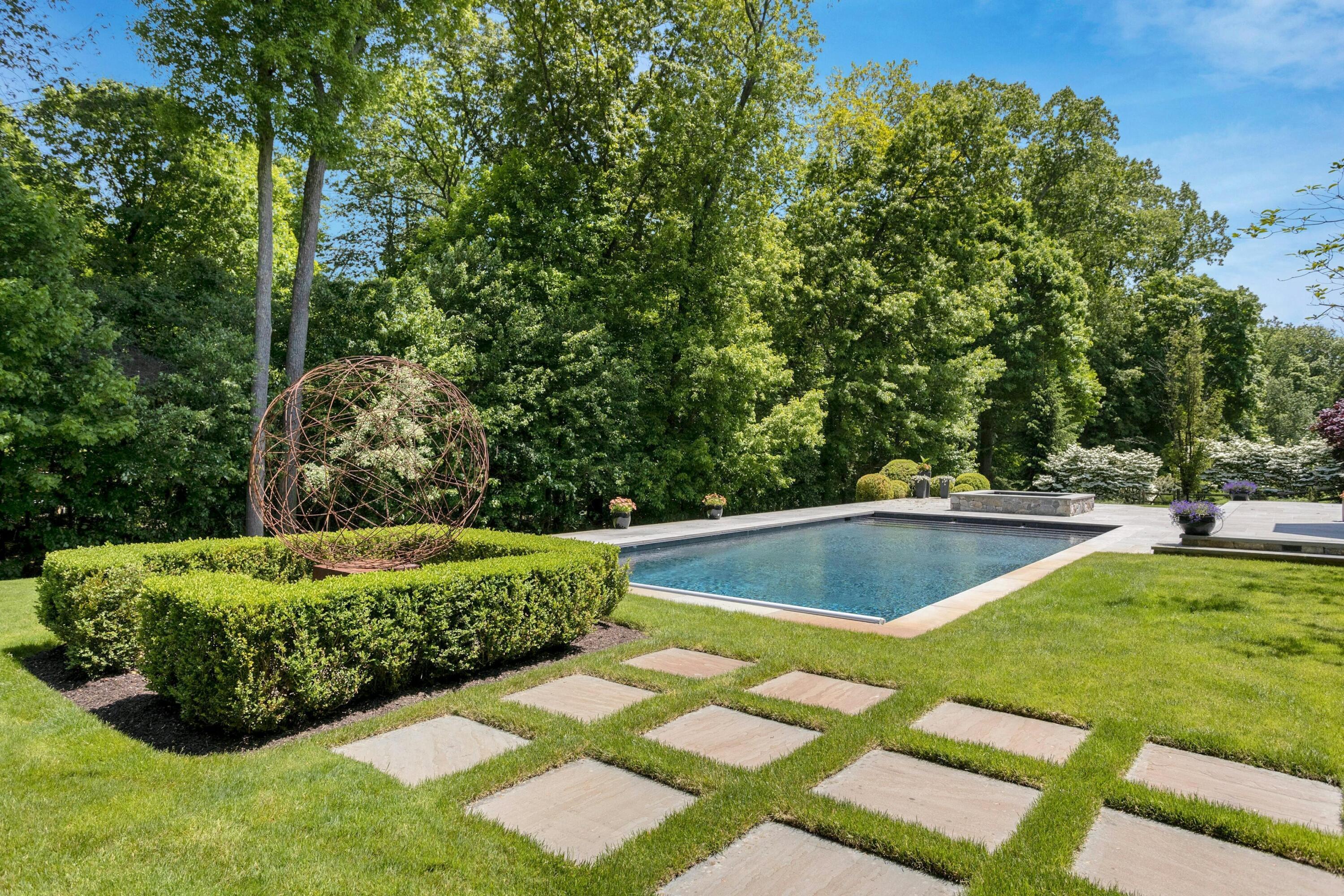 378 Brookside Road Darien, CT 06820 - Photo 36 of 40 a view of a backyard with swimming pool
