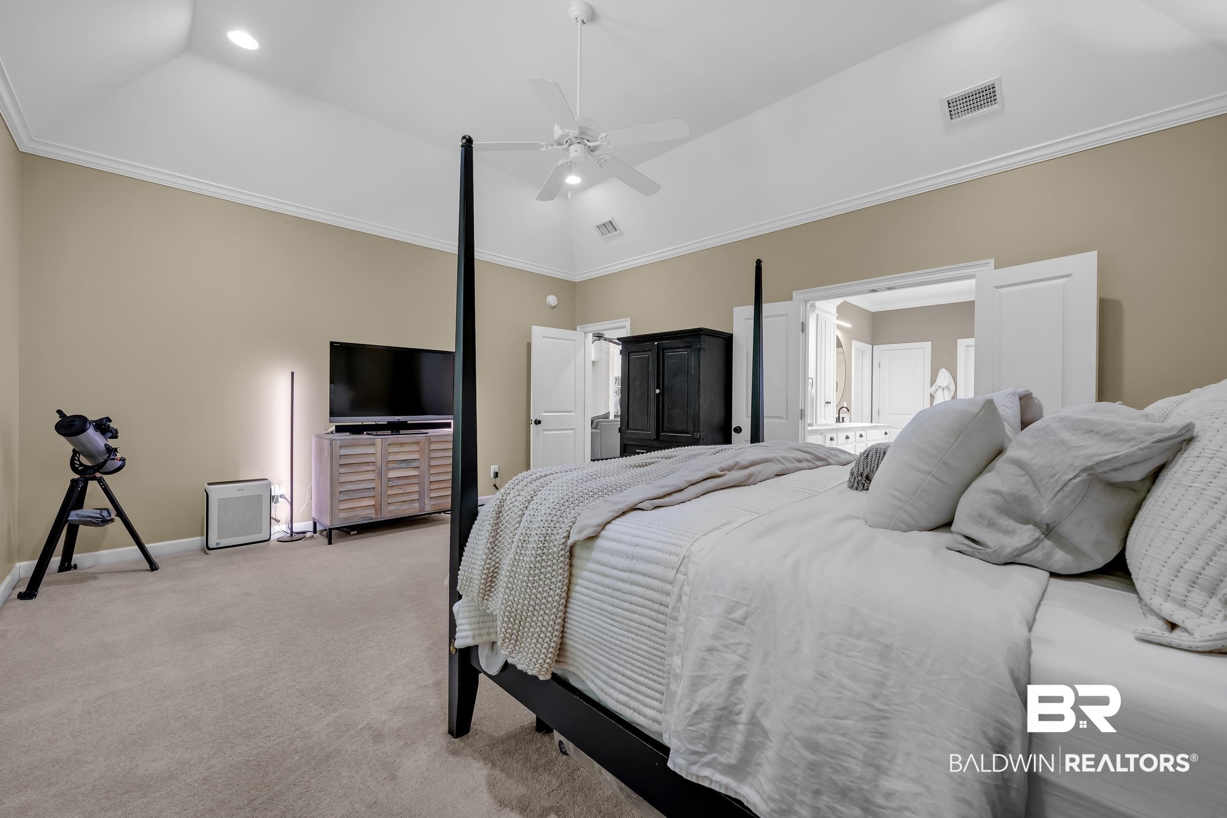 8137 Pine Run Daphne, AL 36527 - Photo 25 of 67 Spacious room featuring vaulted ceilings with recessed lighting, plush carpet flooring, and crown molding