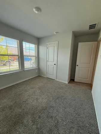 an empty room with a empty space and window