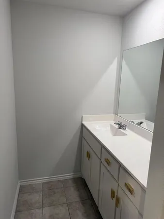 a white toilet sitting next to a bath tub
