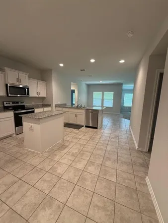 a large kitchen with cabinets