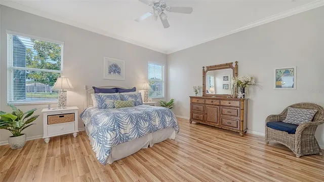 a room with a bed and a table chair