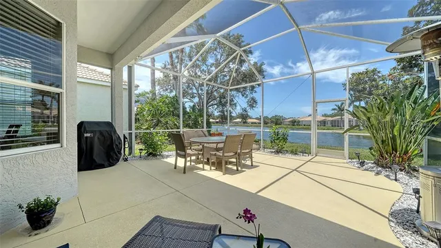 a view of an chairs and table in the patio