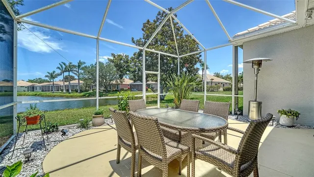 a view of a patio with table and chairs and potted plants