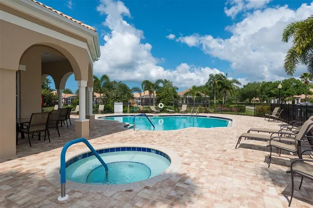 a view of a swimming pool with a lounge chairs