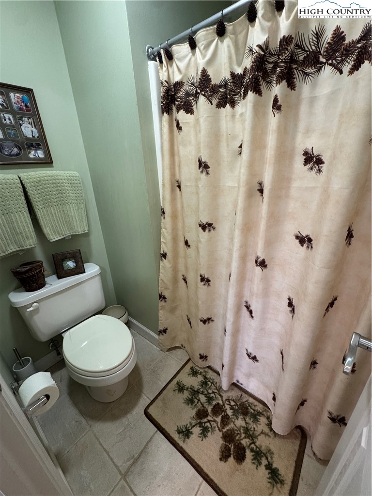 128 Hillcrest Road Newland, NC 28657 - Photo 15 of 37 a bathroom with a sink toilet and shower