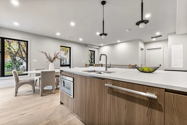 a large kitchen with a large window