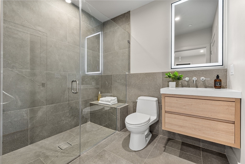 300 Franklin Street, Unit 1 Cambridge, MA 02139 - Photo 17 of 38 a bathroom with a toilet sink and mirror