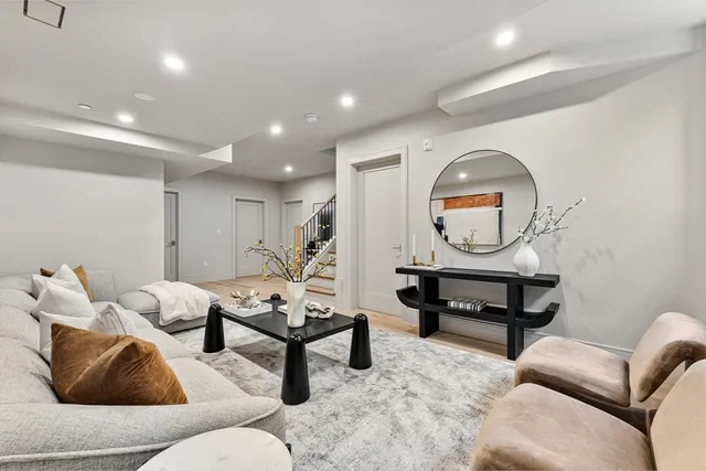 a spacious bedroom with a bed and a cabinets