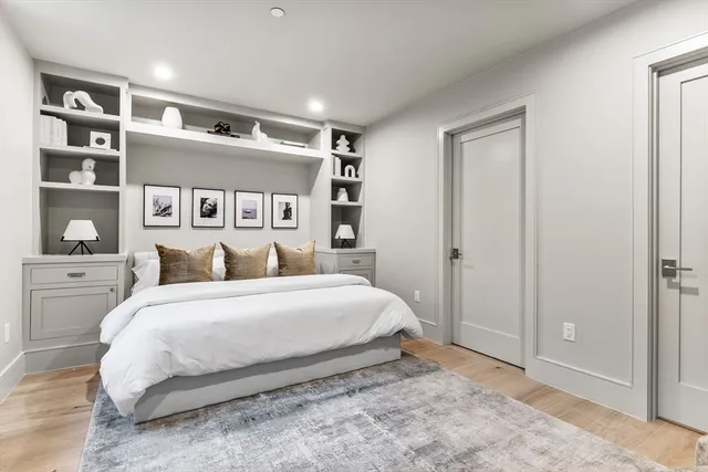 a large white bed in a white room