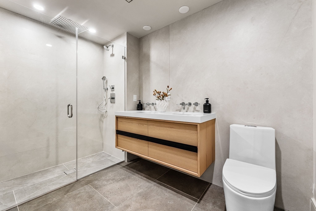 300 Franklin Street, Unit 1 Cambridge, MA 02139 - Photo 26 of 38 a bathroom with a sink a toilet and shower
