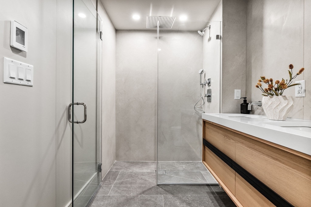 300 Franklin Street, Unit 1 Cambridge, MA 02139 - Photo 27 of 38 a bathroom with a shower and a sink