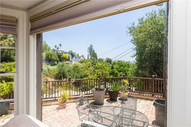 a view of a balcony with lake view and wooden floor