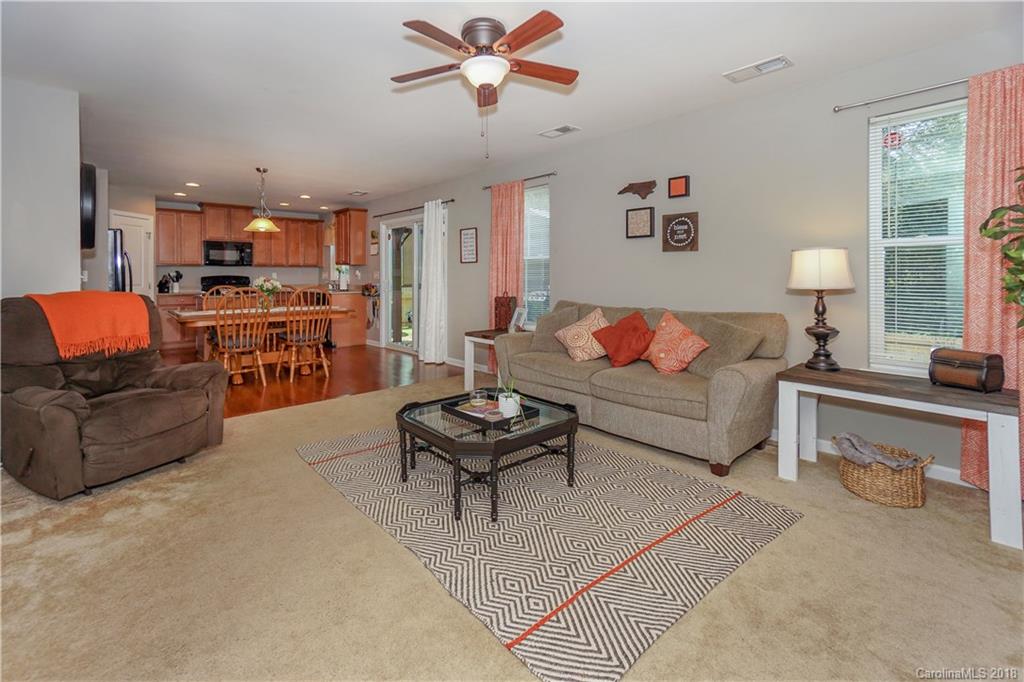 7550 West Berkeley Road, Unit 22 Denver, NC 28037 - Photo 2 of 20 a living room with furniture kitchen view and a window