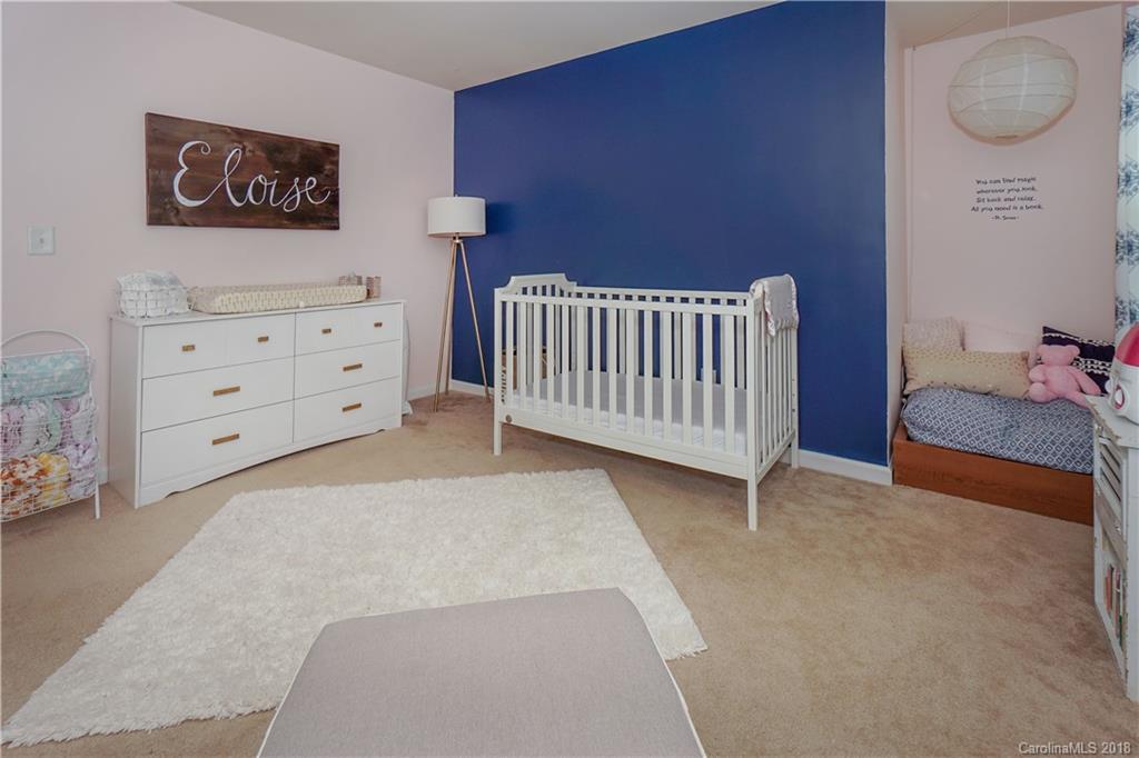 7550 West Berkeley Road, Unit 22 Denver, NC 28037 - Photo 12 of 20 a bedroom with a bed and cabinets