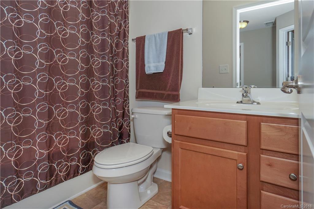 7550 West Berkeley Road, Unit 22 Denver, NC 28037 - Photo 14 of 20 a bathroom with a toilet and a sink