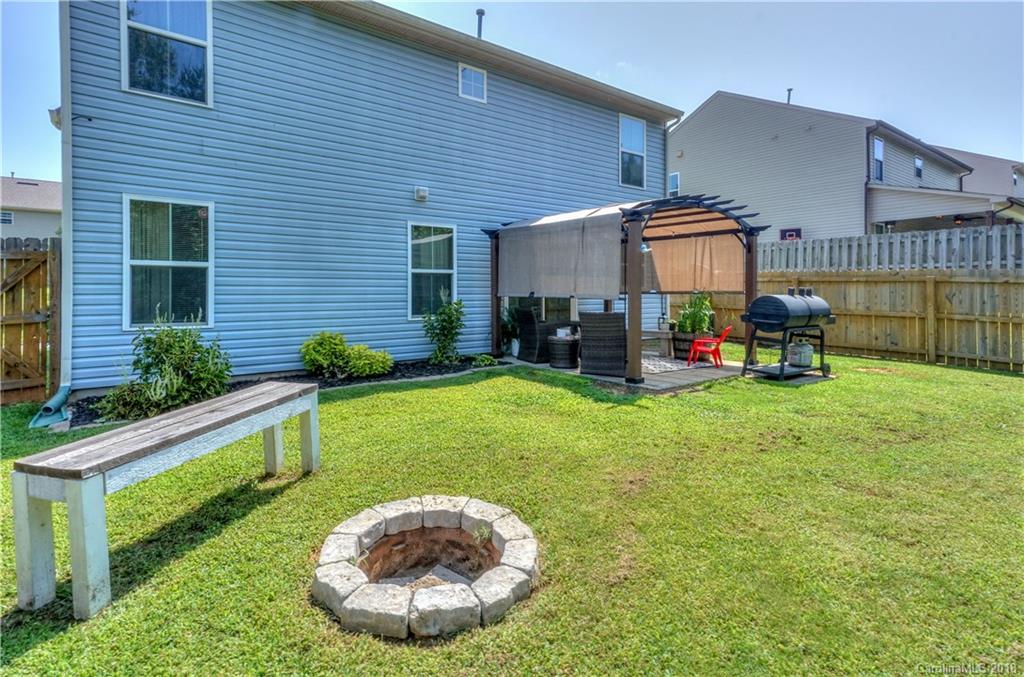 7550 West Berkeley Road, Unit 22 Denver, NC 28037 - Photo 18 of 20 a view of a house with backyard and porch