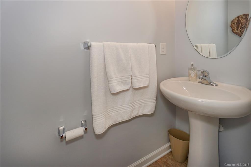 7550 West Berkeley Road, Unit 22 Denver, NC 28037 - Photo 7 of 20 a bathroom with a sink and mirror