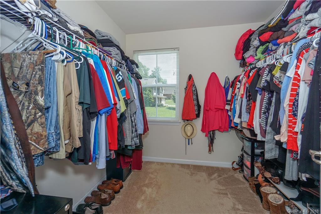 7550 West Berkeley Road, Unit 22 Denver, NC 28037 - Photo 10 of 20 a view of walk in closet with clothes