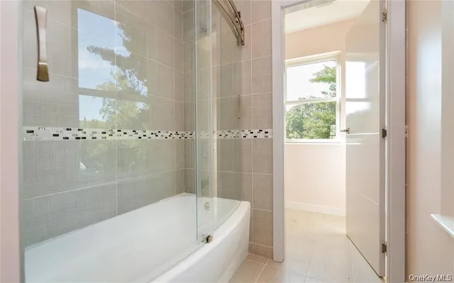 a kitchen with stainless steel appliances granite countertop a refrigerator a stove a sink and a microwave