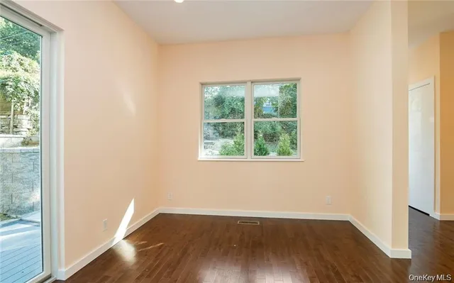 a view of balcony with wooden floor and fence