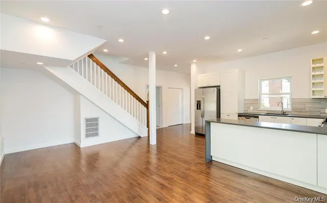a aerial view of a house with large trees