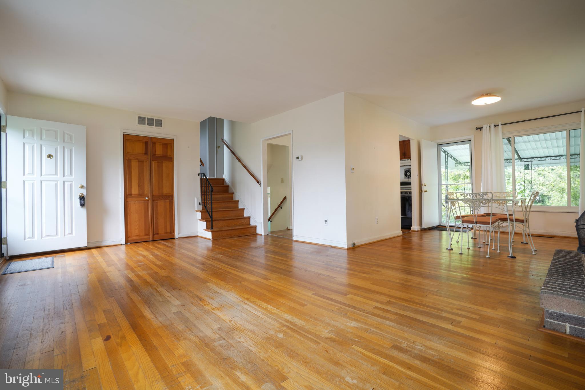 1073 Southridge Road Baltimore, MD 21228 - Photo 4 of 27 a view of empty room with wooden floor and floor to ceiling window