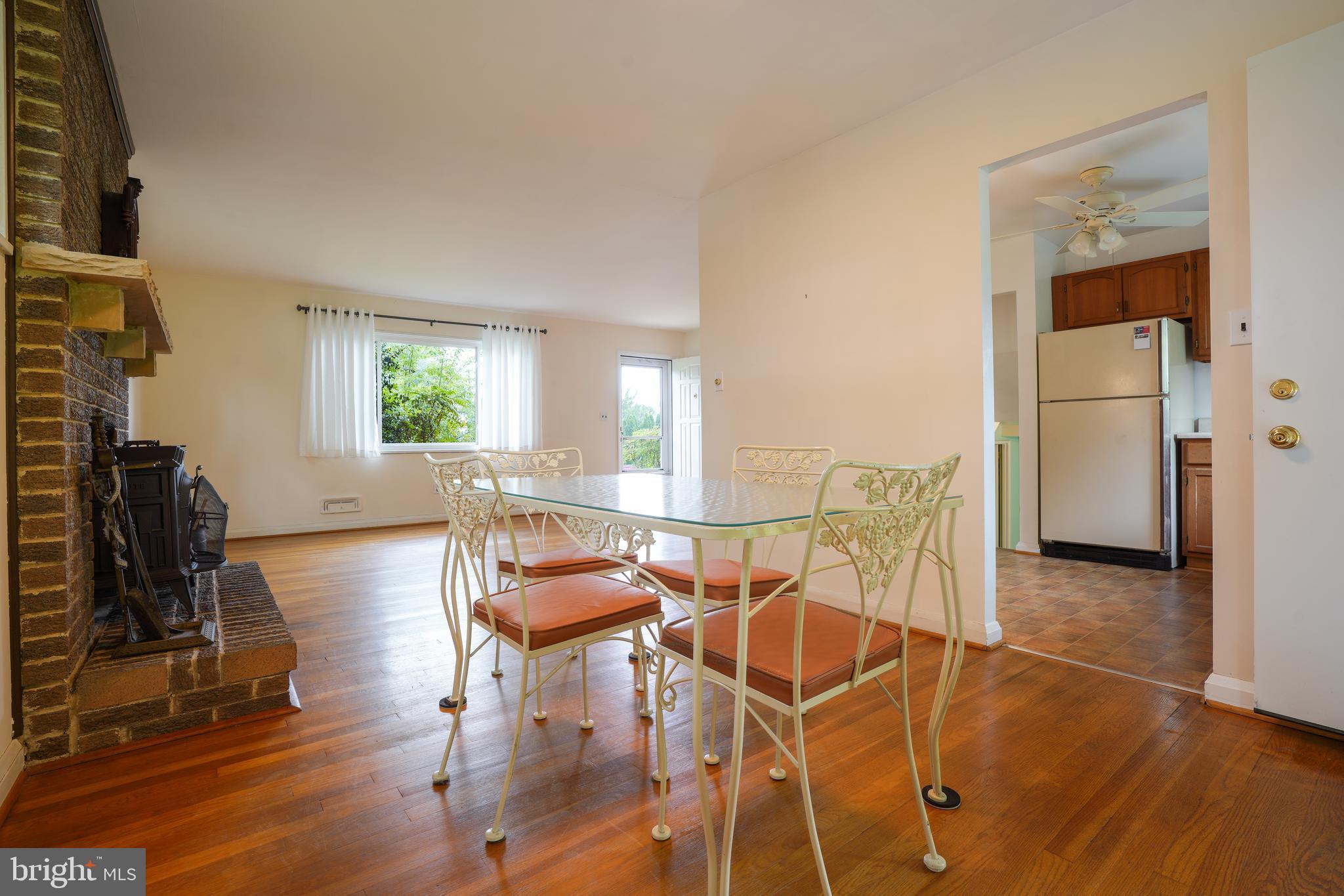 1073 Southridge Road Baltimore, MD 21228 - Photo 7 of 27 a view of a dining room with furniture and wooden floor