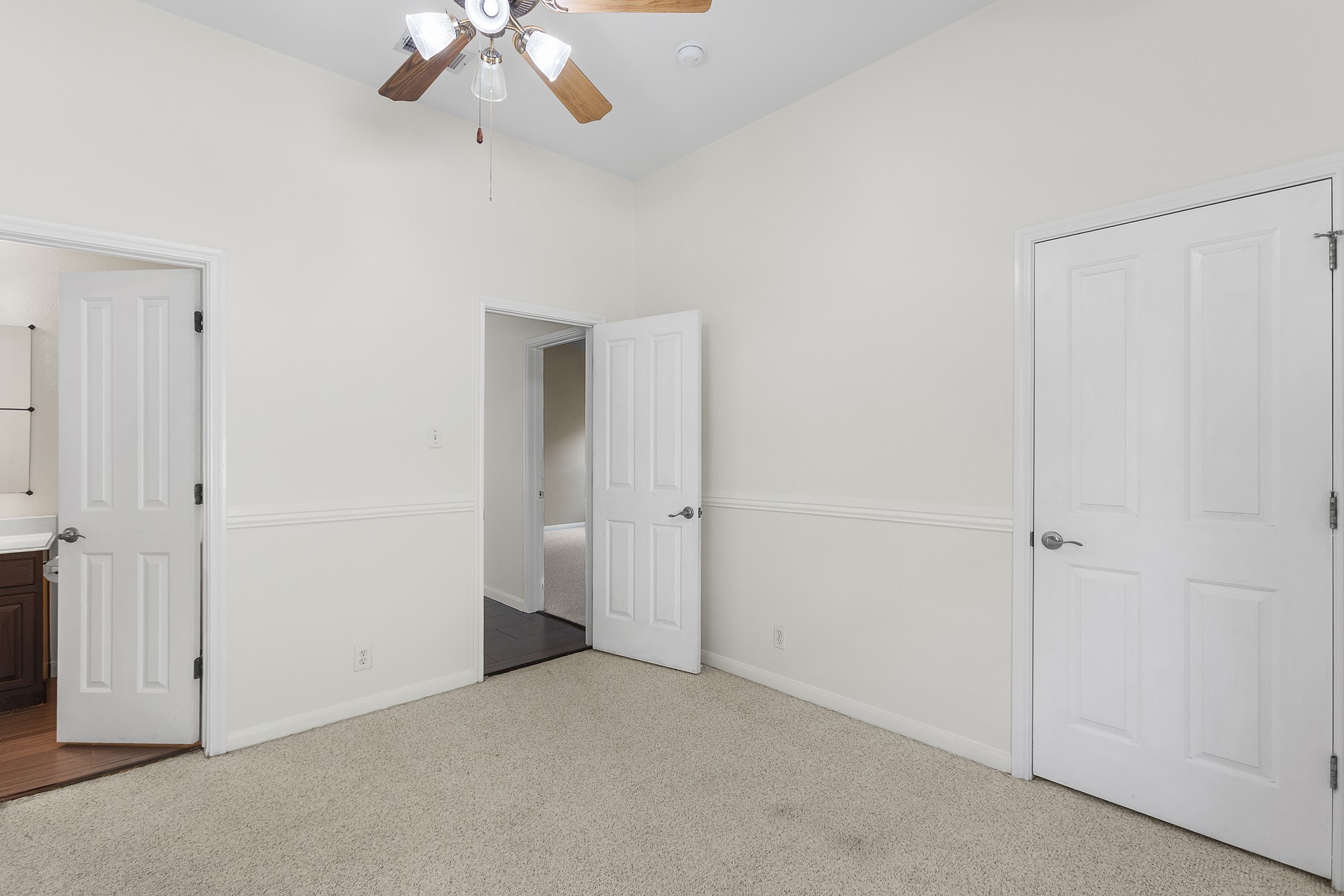 1201 Springbrook Road Pflugerville, TX 78660 - Photo 22 of 33 Well-lit room featuring neutral tones, plush carpeting, and direct access to an adjoining space.