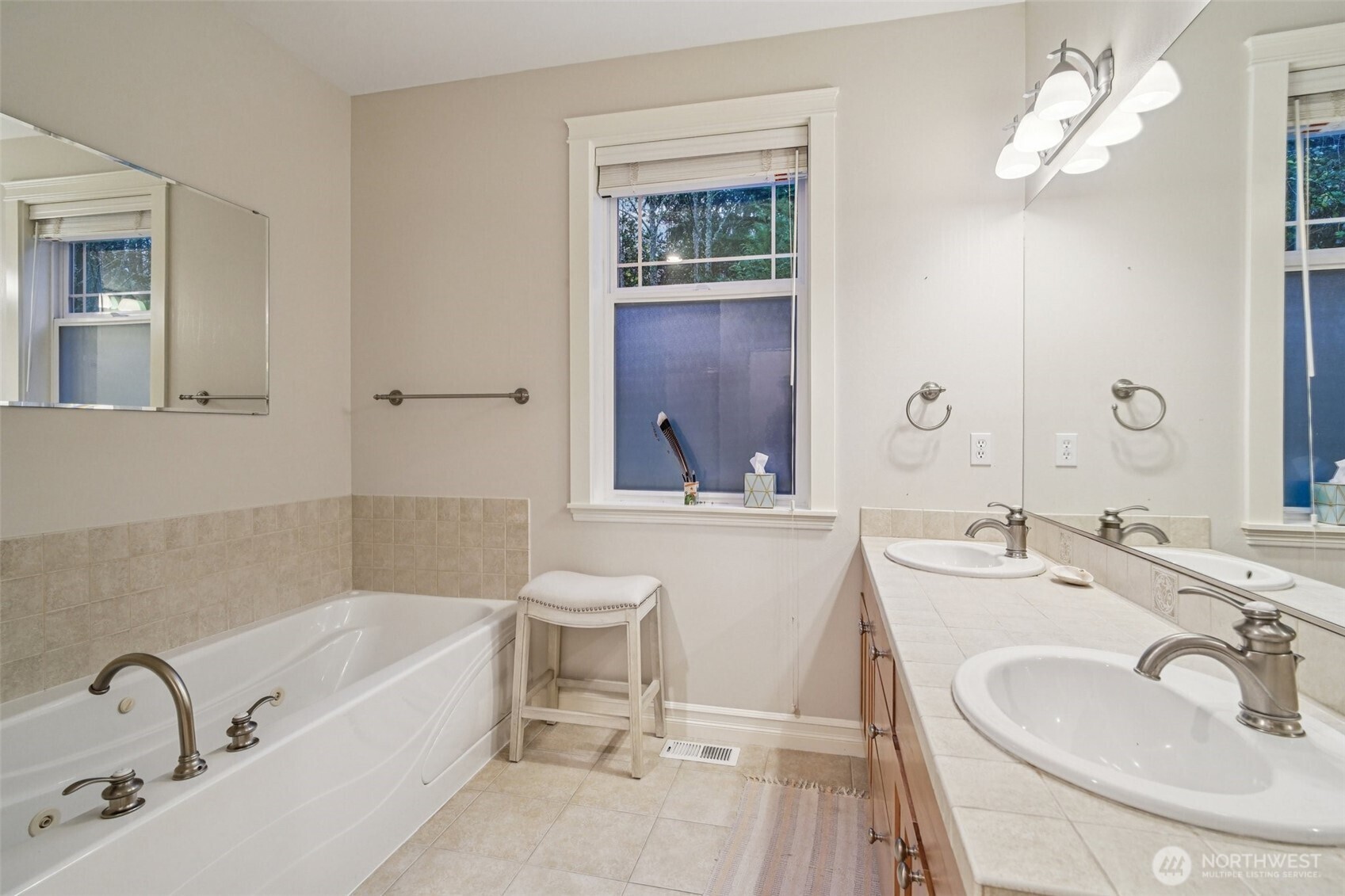 2617 Fir Crest Boulevard Anacortes, WA 98221 - Photo 17 of 31 a bathroom with a tub a sink and mirror
