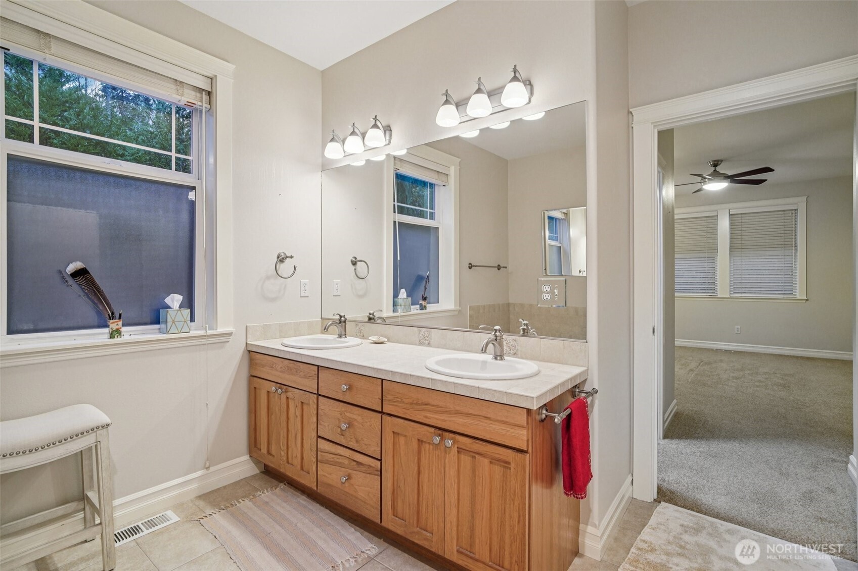 2617 Fir Crest Boulevard Anacortes, WA 98221 - Photo 18 of 31 a bathroom with a double vanity sink mirror and toilet
