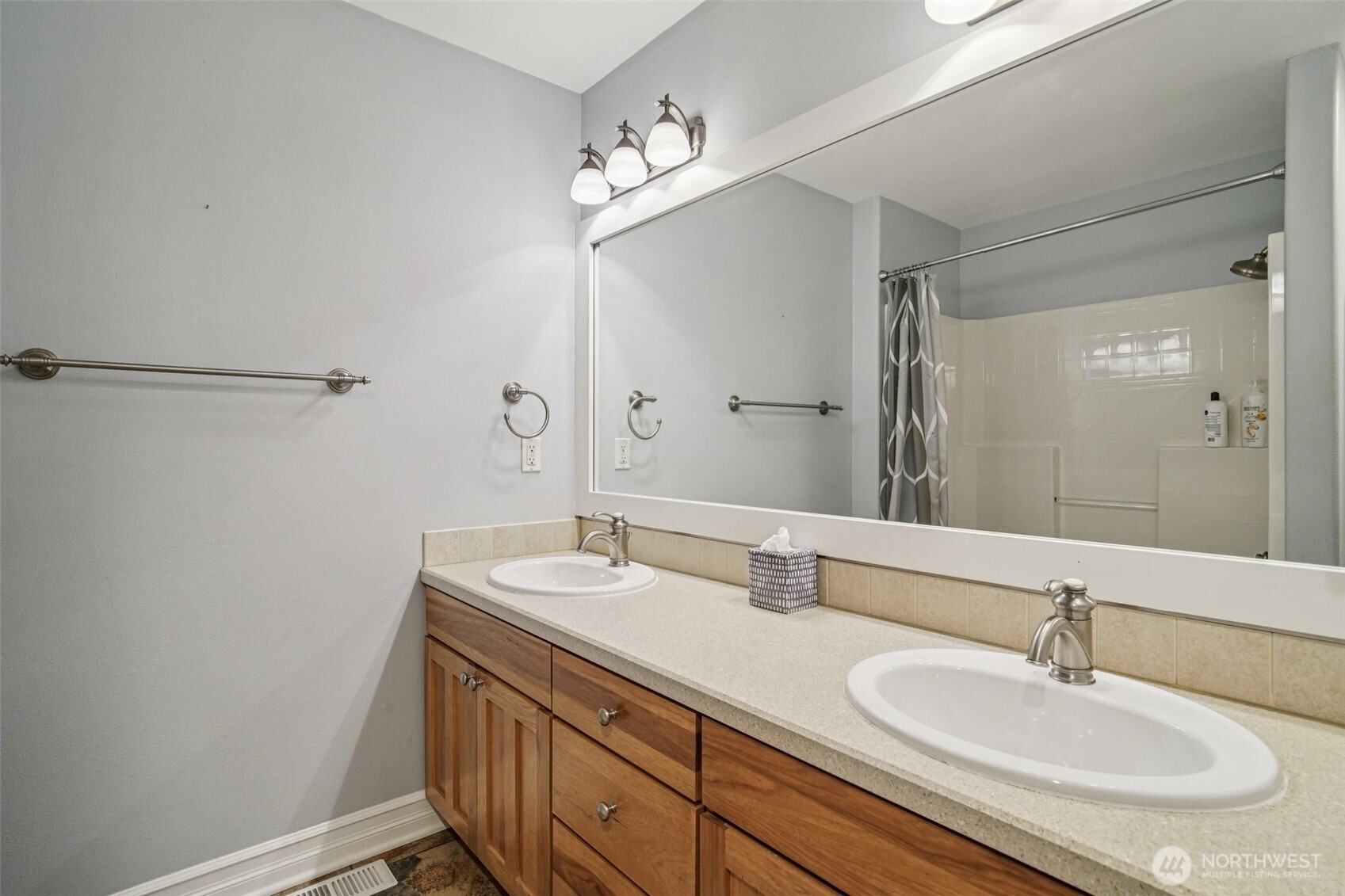 2617 Fir Crest Boulevard Anacortes, WA 98221 - Photo 26 of 31 a bathroom with a sink and a mirror