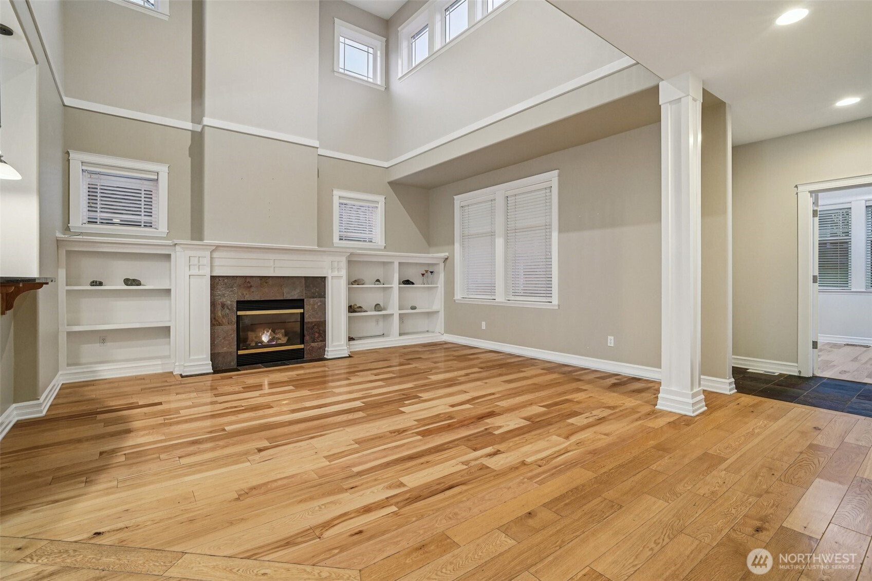 2617 Fir Crest Boulevard Anacortes, WA 98221 - Photo 3 of 31 an empty room with fireplace and wooden floor