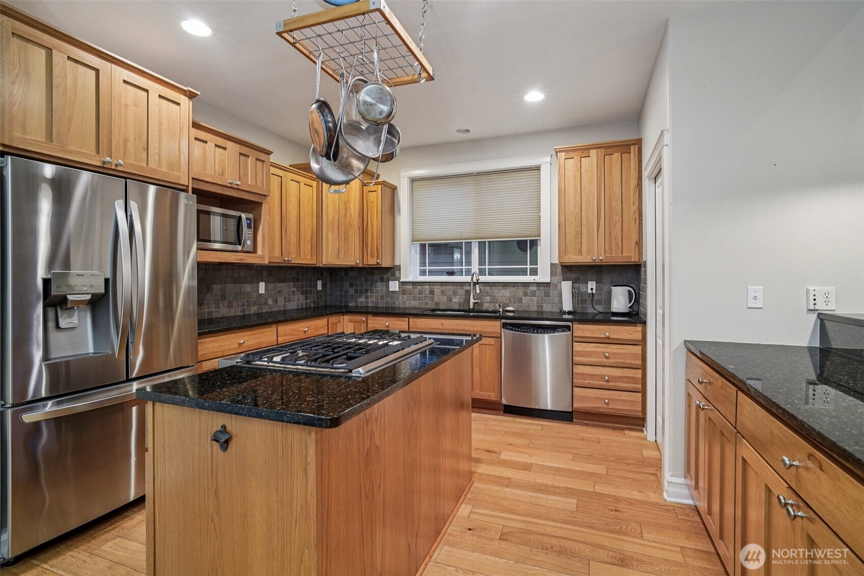 2617 Fir Crest Boulevard Anacortes, WA 98221 - Photo 7 of 31 a kitchen with granite countertop stainless steel appliances a counter space a sink cabinets and a window