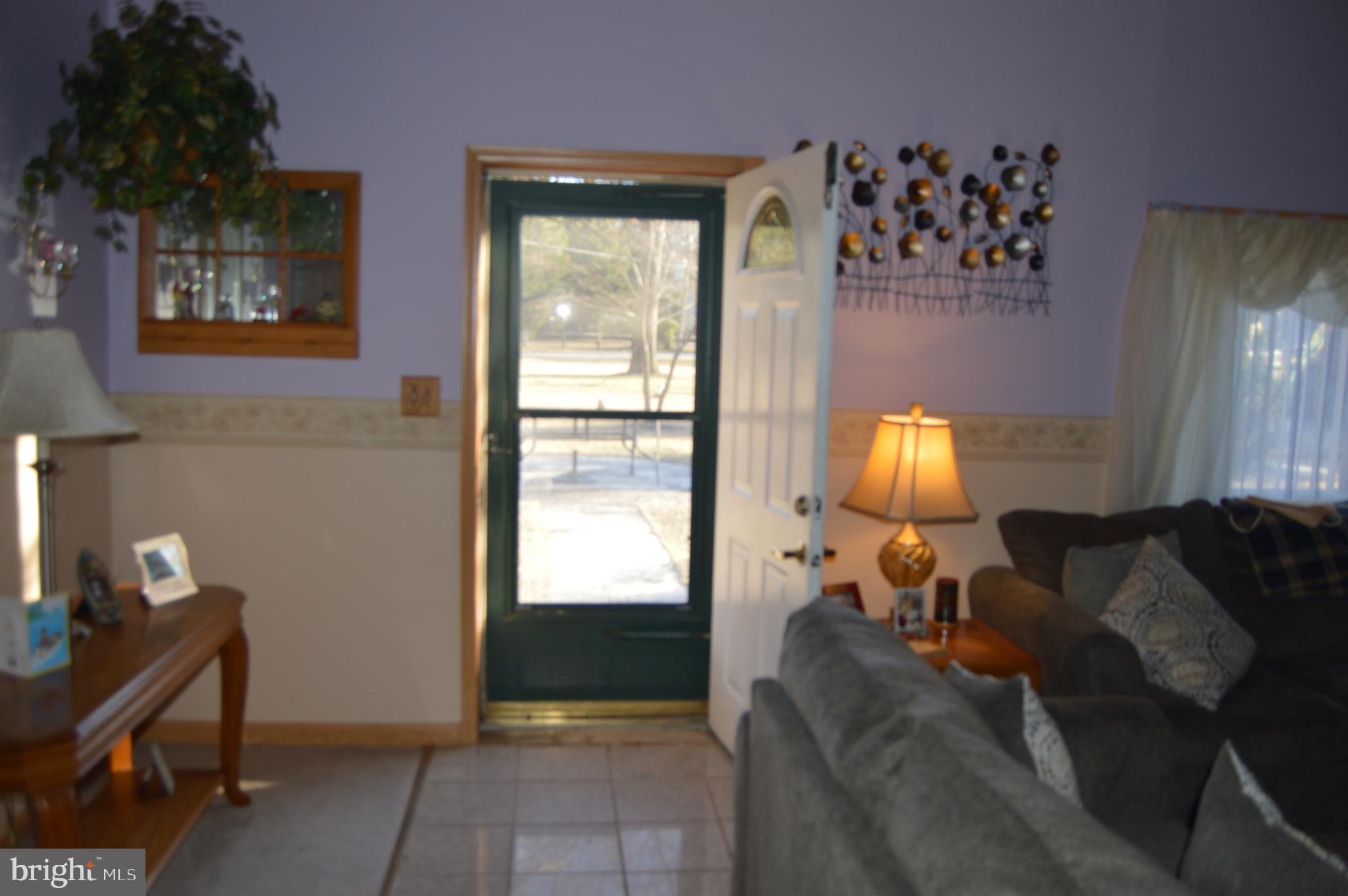 830 Swift Road Pasadena, MD 21122 - Photo 21 of 37 Living room front door