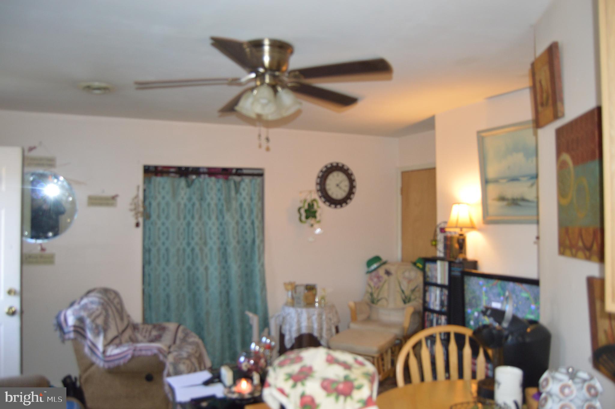 830 Swift Road Pasadena, MD 21122 - Photo 24 of 37 In Law Living Room or Family Rm. w/ceiling fan