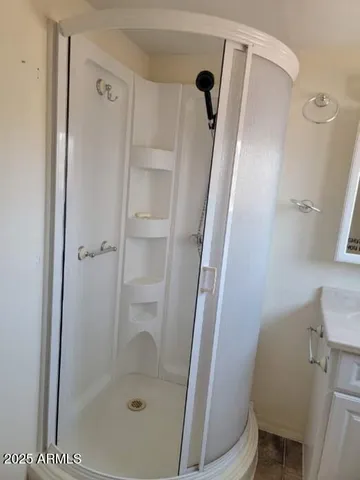 a bathroom with a shower and a toilet
