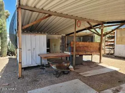 a view of a backyard with table and chairs