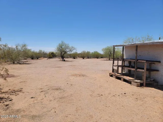 a road with a building in the background