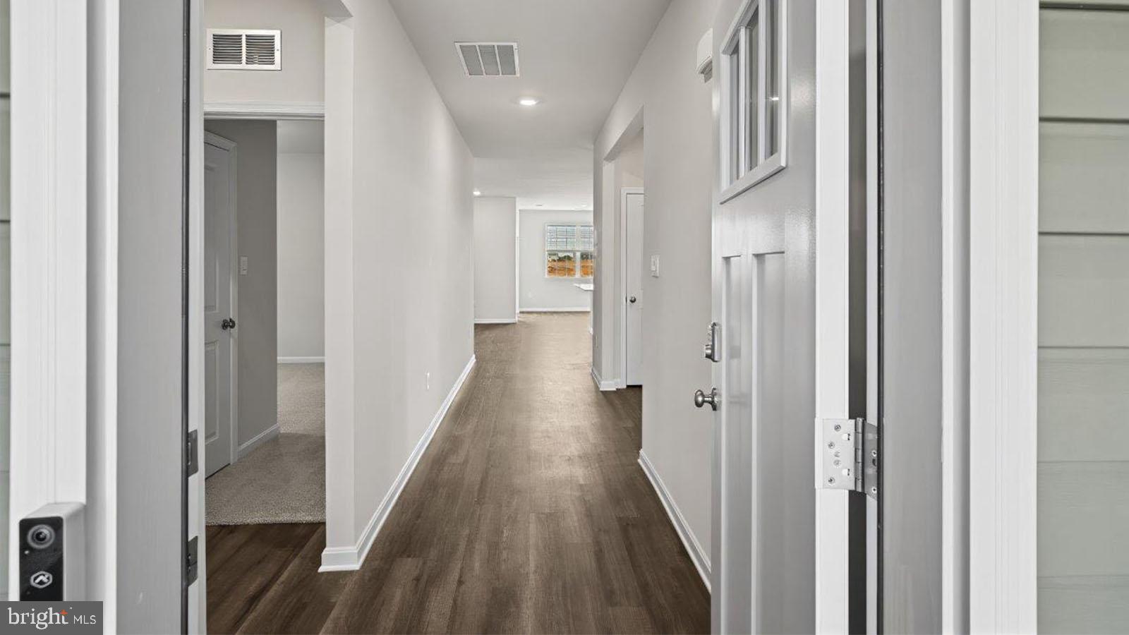 42 Riderwood Way Shepherdstown, WV 25443 - Photo 12 of 28 a view of a hallway with wooden floor and staircase