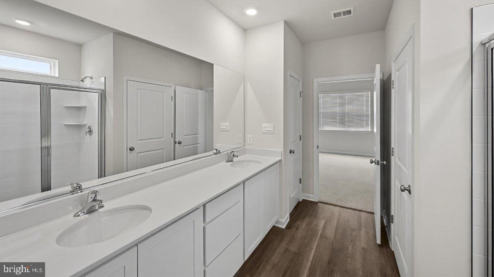 42 Riderwood Way Shepherdstown, WV 25443 - Photo 15 of 28 a bathroom with a double vanity sink mirror and shower