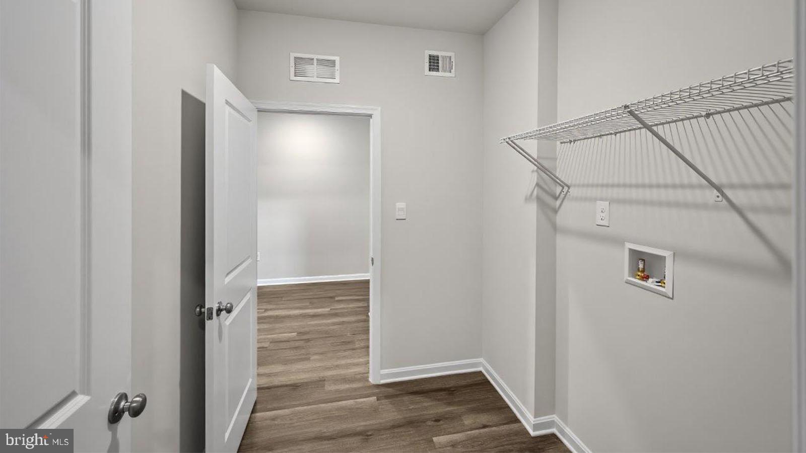 42 Riderwood Way Shepherdstown, WV 25443 - Photo 21 of 28 a view of hallway with stairs and wooden floor