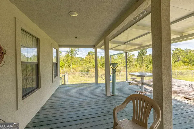 a view of a backyard with a sink and a porch