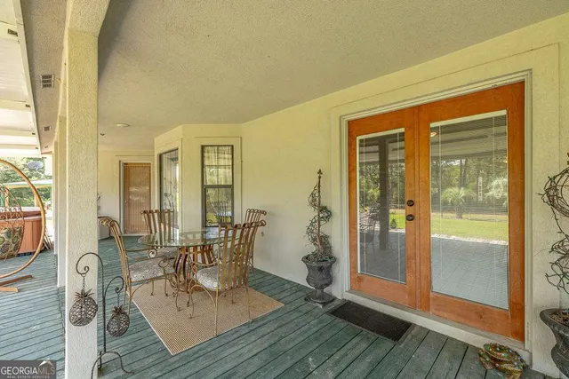 a view of a swimming pool with a patio