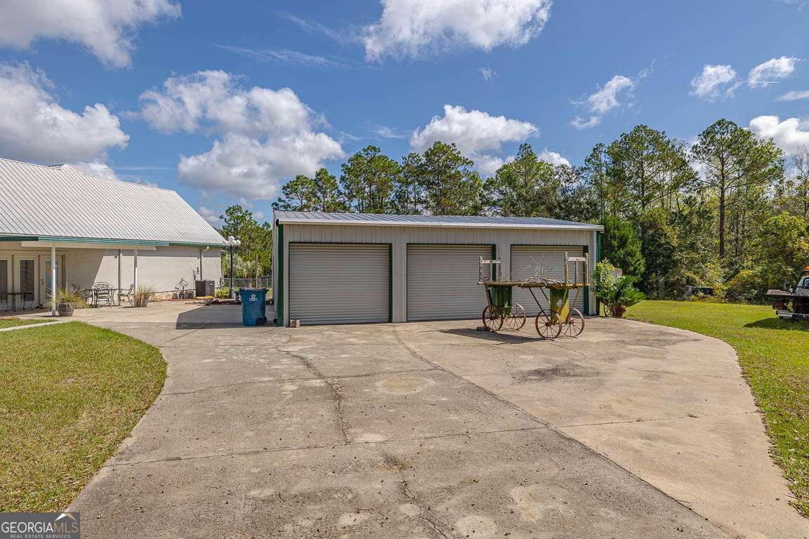 220 Chickasaw Road Hoboken, GA 31542 - Photo 2 of 55 a view of a house with backyard and sitting area