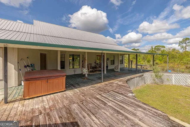 a front view of house with an outdoor space and seating