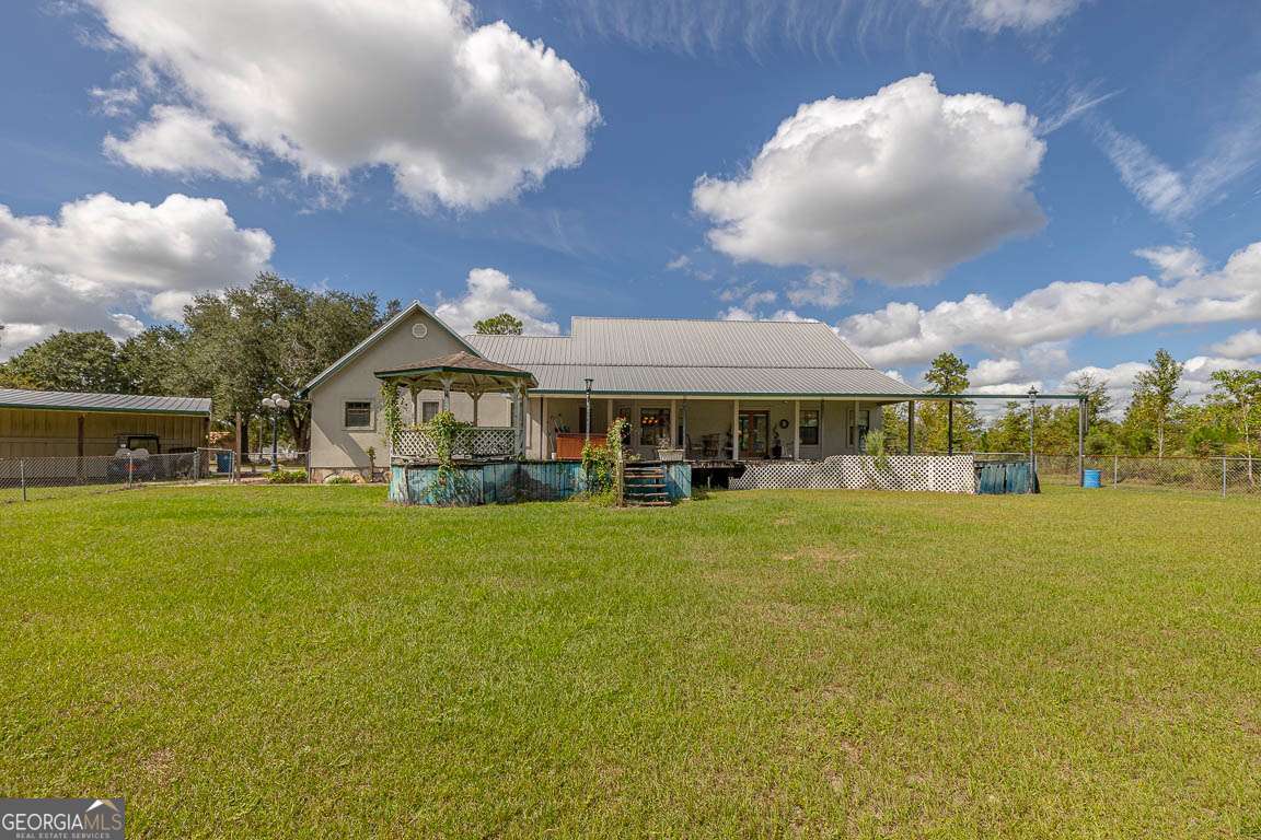220 Chickasaw Road Hoboken, GA 31542 - Photo 28 of 55 a front view of house with an outdoor space and seating